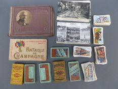 A collection of French WWI postcards and various cigarette cards
