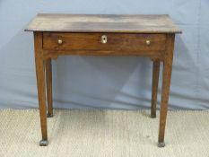 A Georgian oak or elm lowboy,