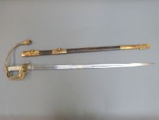 An early 20th century British Naval sword, the etched blade with king's crown,