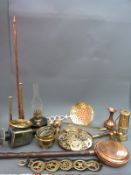 A 19thC coaching lamp, horse brasses, hunting horns, warming pan,