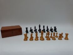 A wooden chess set stamped with red crown marks possibly Jaques Staunton, in mahogany box.