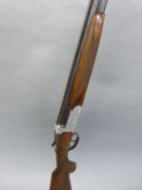 Contento 12 bore over and under shotgun with engraved locks, top plate and top lever,