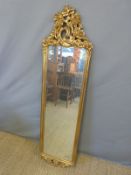 An ornate giltwood mirror,