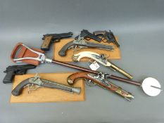 Eight replica pistols including flintlock, percussion etc,