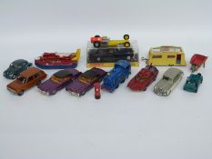 Fourteen Dinky Toys diecast model cars and accessories including Spectrum Patrol Car, train,