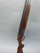 Baikal 12 bore over and under ejector shotgun with engraving to the locks,