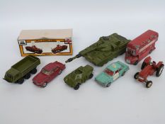 Seven Dinky Toys diecast model vehicles including military tank,