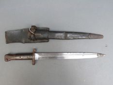 An 1888 Lee Metford bayonet in scabbard with leather frog