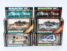 Four Scalextric model racing cars comprising Brabham BT 49 Parmalat C139,