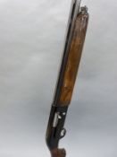 Beretta A 301 12 bore semi-automatic shotgun with engraved locks, chequered semi-pistol grip,