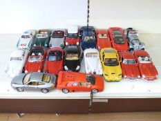 Eighteen Burago 1:18 scale diecast model sports cars including Ferrari, Porsche, Jaguar, Mercedes,