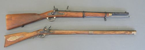 Two replica hammer action rifles, one percussion,