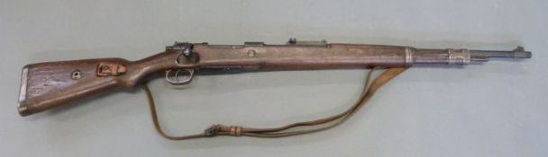 Deactivated Mauser K98 bolt action rifle with adjustable rear sight, leather sling,