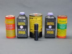 A large quantity of shotgun cartridge powder together with a SAK .22 LR sound moderator.