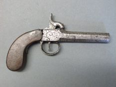 Percussion hammer action pistol with engraved lock, top plate and trigger guard,