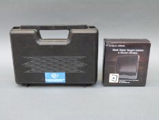 A hard pistol case with Colt branding and foam interior together with an Anglo Arms steel paper