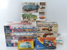 Fourteen Revell, Heljan and Airfix model kits comprising mainly trucks and commercial vehicles,