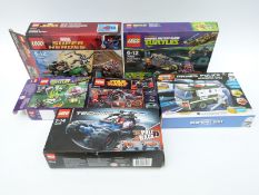 Five Lego and one Bloc Tech kit,