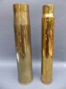 Two large brass shell cases