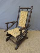 A late 19thC American walnut child's rocking chair