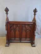 A 19thC oak lectern with carved frieze and moulded Gothic decoration,