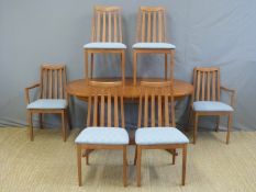 A G-Plan extending dining table and six (4+2) chairs, maximum length 192cm,
