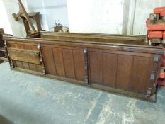 A 19thC oak church pew with shelf to rear, length 236cm,