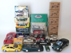 Twenty-three Corgi, Cameo and similar diecast model vehicles including James Bond, Le Mans Cars etc,