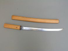 Japanese wakizashi short sword in wooden sheath with mount Fuji decoration to habaki