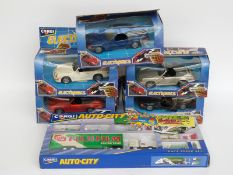 Five Corgi Electronics diecast model cars and a Corgi Auto-City Race Super Set,