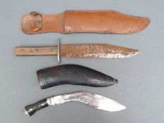 An 'Original Bowie Knife' in leather sheath, overall length 38cm, and a small kukri,