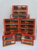 Nineteen Hornby 00 gauge carriages and wagons,