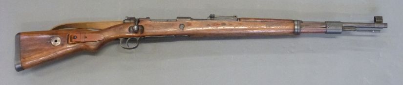 Deactivated Mauser K98 bolt action rifle with adjustable rear sight, leather sling,