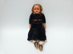 German doll with open mouth, weighted brown eyes, brown hair and kid leather jointed body,