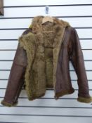 A WWII Coastal Command flying jacket with yellow hood,