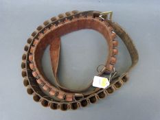 Two brown leather 12 bore shotgun cartridge belts