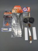 A collection of new gun cleaning kits and accessories together with two unopened penknives,