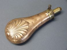 James Dixon & Sons copper and brass powder flask with embossed shell decoration to both sides,