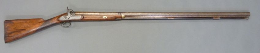Howe of Colchester 8 bore percussion hammer action gun with scrolling decoration,