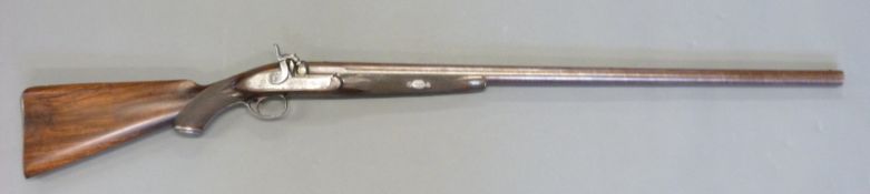 Unnamed 9 bore live pigeon gun with engraved lock, hammer, trigger guard, butt plate and top plate,