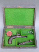 Percussion hammer action muff pistol with engraved lock and stylised dolphin hammer, chequered grip,