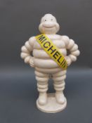 A cast iron Michelin man figure,