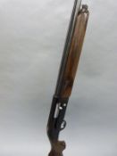 Beretta A 301 12 bore semi-automatic shotgun with ornate engraving, semi-pistol grip,