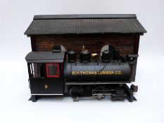 Bachmann G gauge 0-4-0 Ely-Thomas Lumber Co locomotive together with a scratch built engine shed