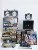Thirty-two Corgi and other James Bond 007 diecast model cars, kits, posters etc,