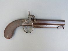 Percussion hammer action pistol with engraved lock, top plate,