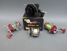 A boxed Mitchell 386 fixed spool reel,