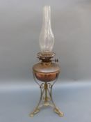 A Hinks oil lamp on ornate stand