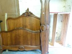 A French style carved walnut double bed (ends, rails and base),