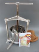 A metal fruit or cider press